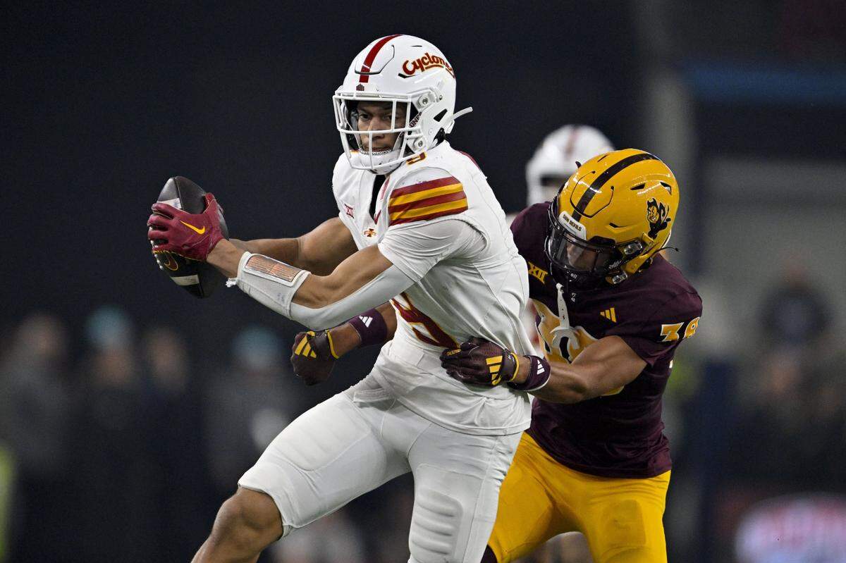 Dec 7, 2024; Arlington, TX, USA; Iowa State Cyclones wide receiver Jayden Higgins (9) and Arizona State Sun Devils defensive back Kyan McDonald (38) in action during the game between the Iowa State Cyclones and the Arizona State Sun Devils at AT&T Stadium. Mandatory Credit: Jerome Miron-Imagn Images