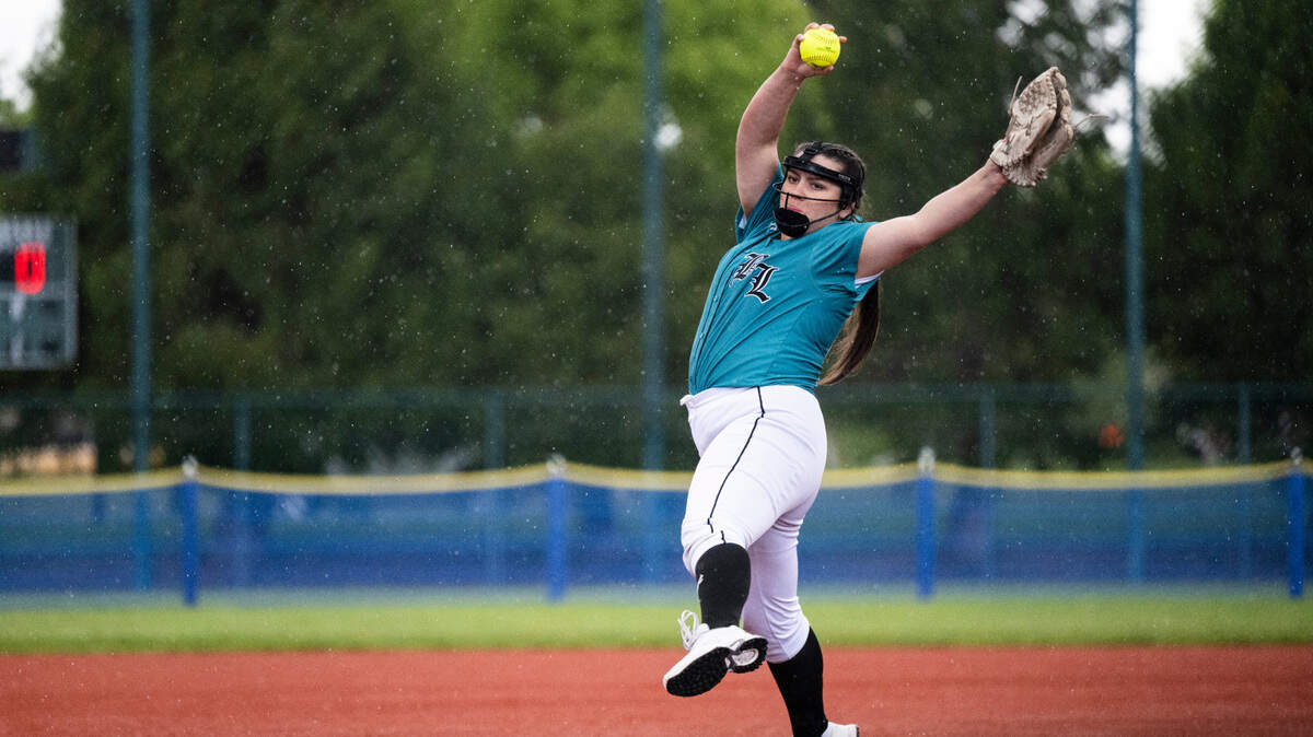 Bonney Lake’s pitcher Bella Carazo, 20, pitches the ball during the 3A state softball tournament quarterfinals at the Regional Athletic Complex on Friday, May 27, 2022 in Lacey, Wash. Bonney Lake defeated Peninsula 3-2 with a triple play in the seventh inning to win the quarterfinal game.
