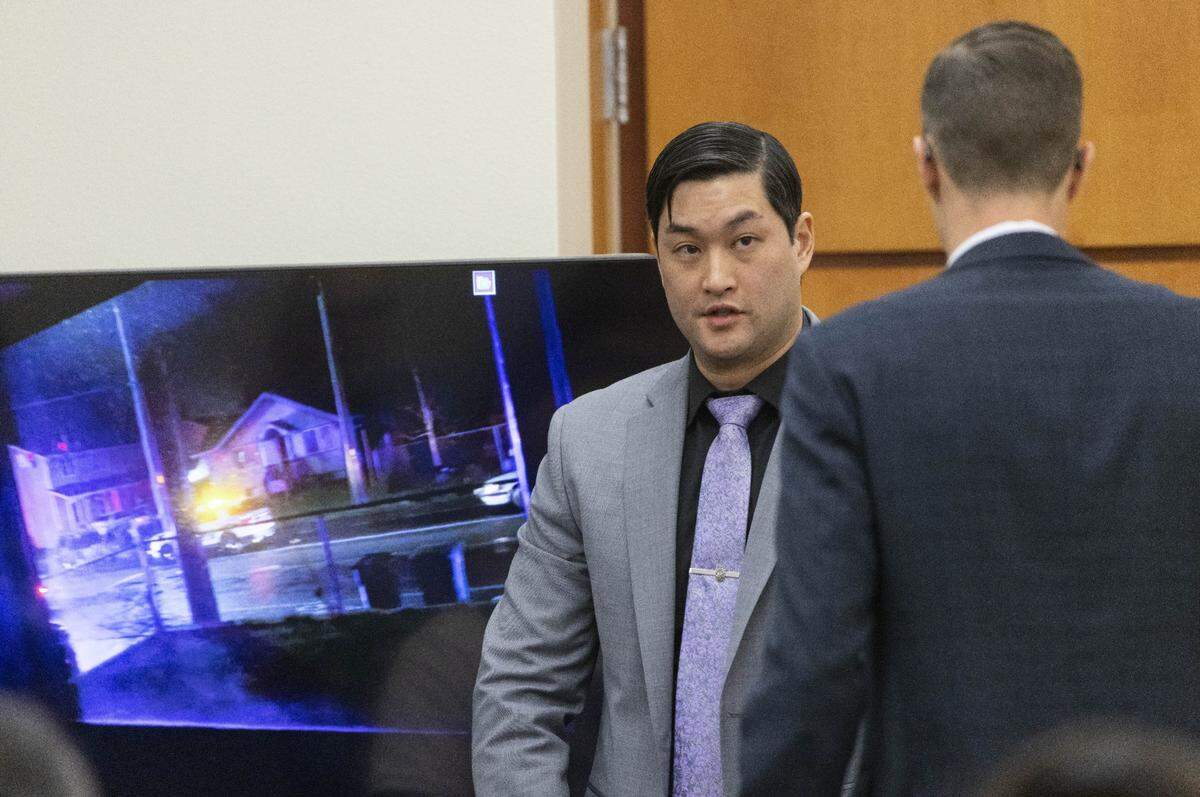 Defendant Timothy Rankine answers questions from defense attorney Mark Conrad, right, during the trial of three Tacoma Police officers in the killing of Manny Ellis at Pierce County Superior Court, Wednesday, Dec. 6, 2023, in Tacoma, Wash. Tacoma Police Officers Christopher Burbank, Matthew Collins and Timothy Rankine stand trial for charges related to the March 2020 killing of Manny Ellis. (Ellen M. Banner / Pool / The Seattle Times)