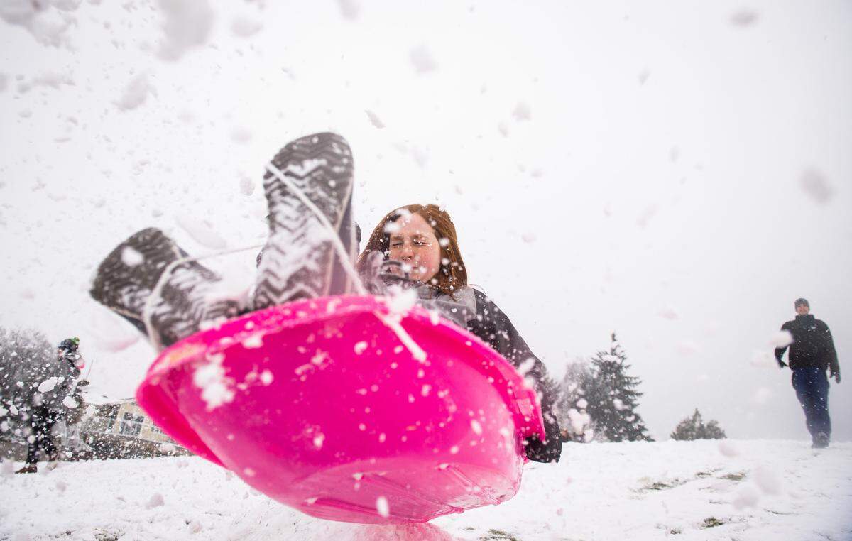 Harli Barker, 12, goes off a jump while sledding at Vassault Park in Tacoma, Wash., on Friday, Feb. 8, 2019.