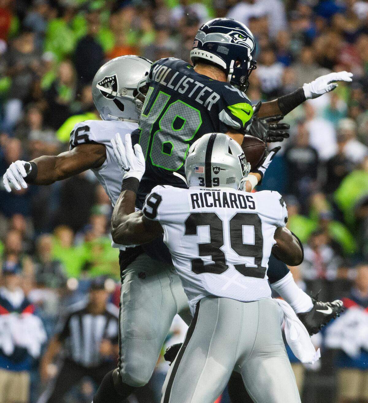 Seattle Seahawks tight end Jacob Hollister (48) pulls down a touchdown pass during the second quarter. The Seattle Seahawks played the Oakland Raiders in a National Football League game at CenturyLink Field in Seattle, Wash., on Thursday, Aug. 29, 2019.