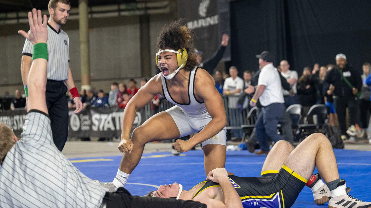 Lincoln’s Navarre Dixon celebrates after pinning Hermiston’s Jaxson Gribskov in the 182-pound, Class 3A championship match at Mat Classic XXXIV on Saturday, Feb. 18, 2023, at the Tacoma Dome in Tacoma, Wash. Dixon pinned Gribskov in 1 minute, 27 seconds.