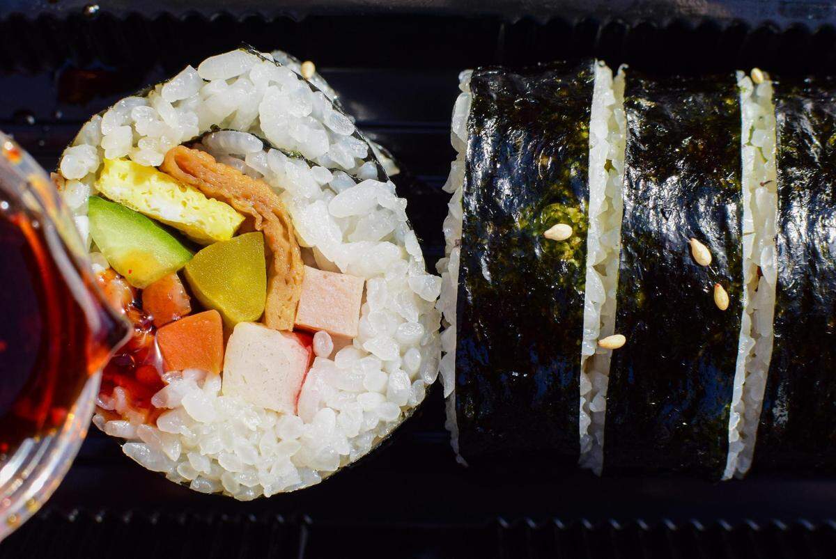 Kimbap makes a great snack or a light lunch. Rolls House makes theirs in-house, filling the seaweed-rice roll with tiny cubes of ham, cucumber, carrot and pickled radish, plus an omelet-style egg and fish cake.