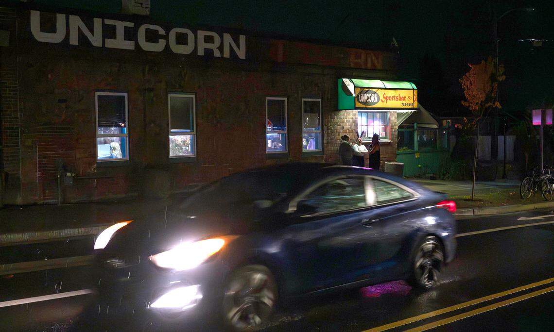 Patrons outside the Unicorn Sports Bar & Grill in Ruston, Washington, Friday, Oct. 25, 2024.