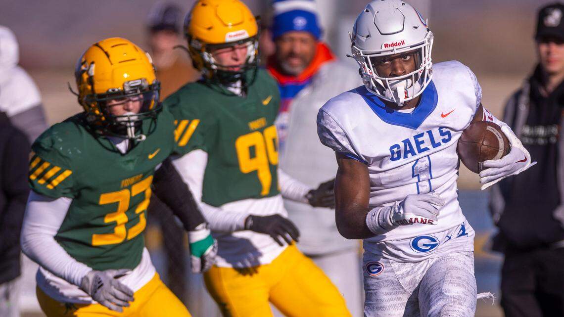 Bishop Gorman WR Zachariah Branch (1) beats Bishop Manogue LB Gio Granata (33) and DB Carson Jensen (99) into the end zone during the second half of their 5A state championship game on Saturday, Nov. 19, 2022, in Carson City, Nev.