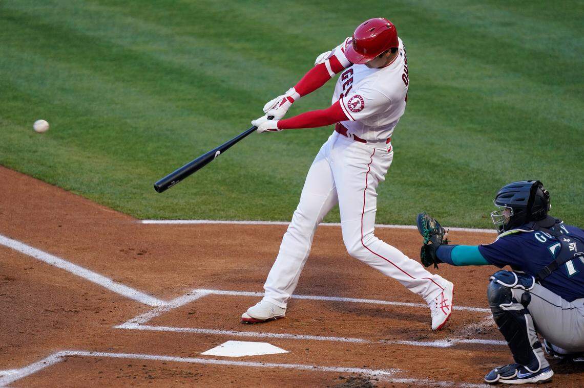 Los Angeles Angels designated hitter Shohei Ohtani (17) hits a home run during the first inning of a baseball game against the Seattle Mariners Saturday, June 5, 2021, in Anaheim, Calif. (AP Photo/Ashley Landis)