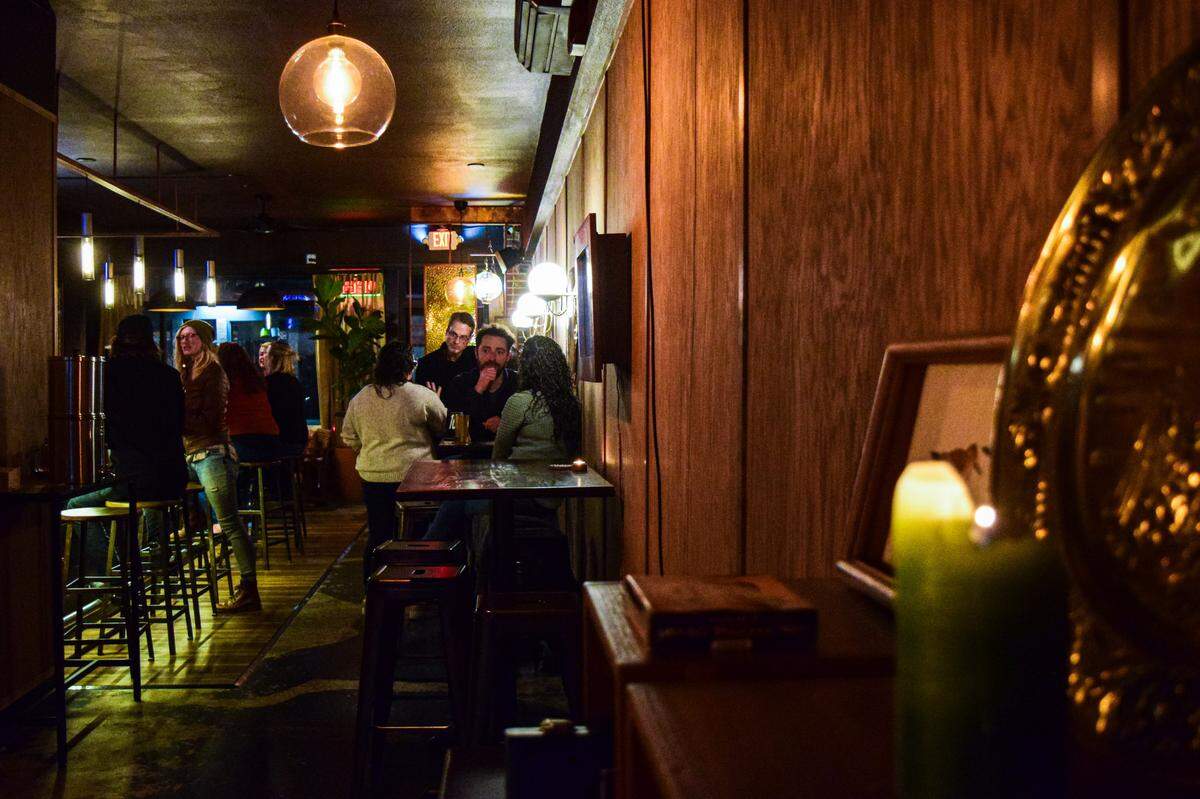 Holy Moly feels like both a neighborhood bar and a quiet, but not too quiet, date-night destination. Vintage touches combined with salvaged materials add to the ’70s-inspired aesthetic.