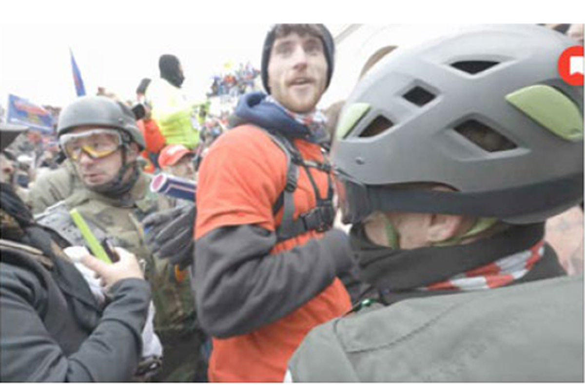 Federal prosecutors say video and photos show 20-year-old Caden Gottfried of Orting at the Jan. 6, 2021, Capitol attack joining a crowd the pushed police.