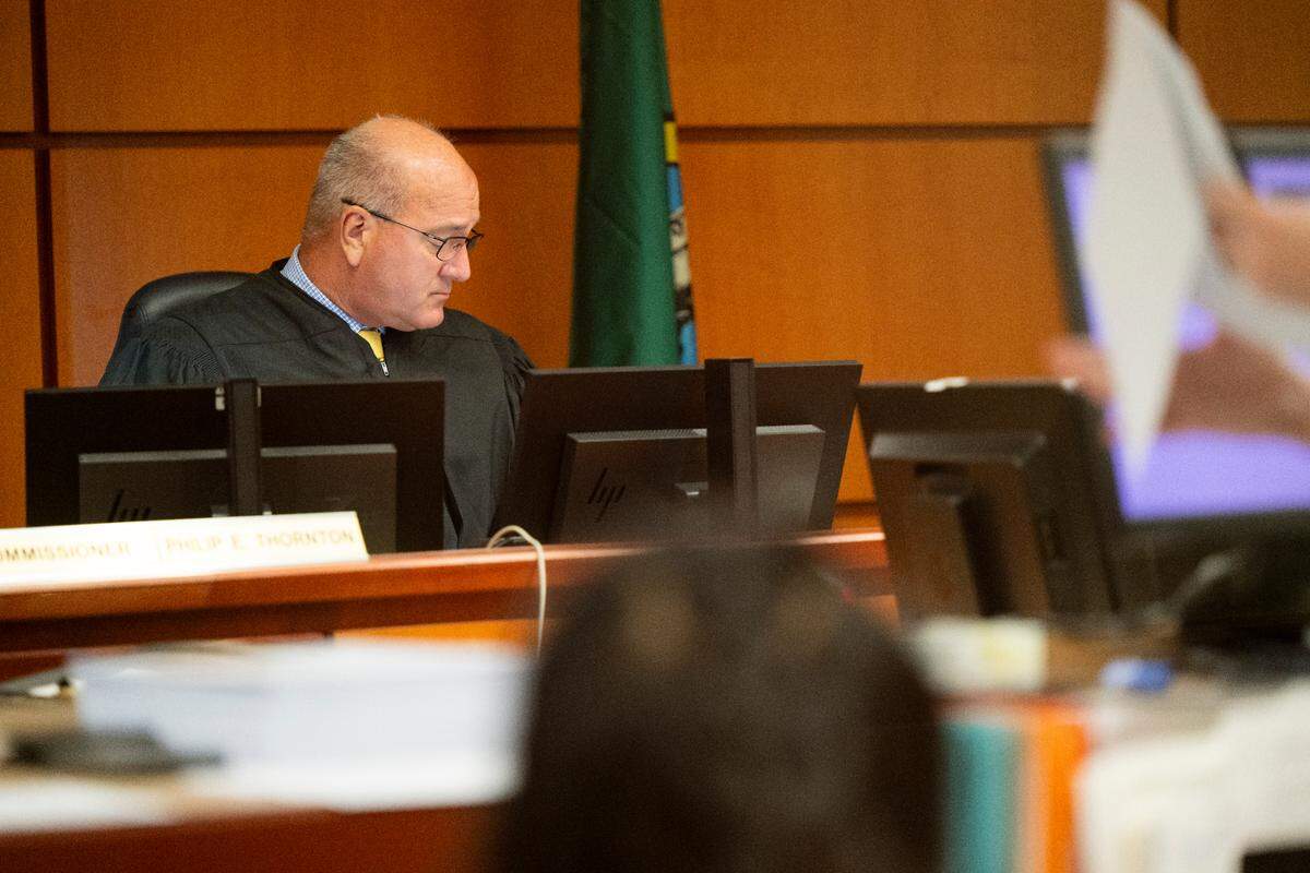 Commissioner Phillip Thornton presides over arraignments at Pierce County Superior Court, on Monday, Aug. 5, 2024, in Tacoma. Proposed changes to public-defense standards being considered by the state Supreme Court could necessitate tripling the staffing and funding for the Department of Assigned Counsel, which represents indigent defendants.