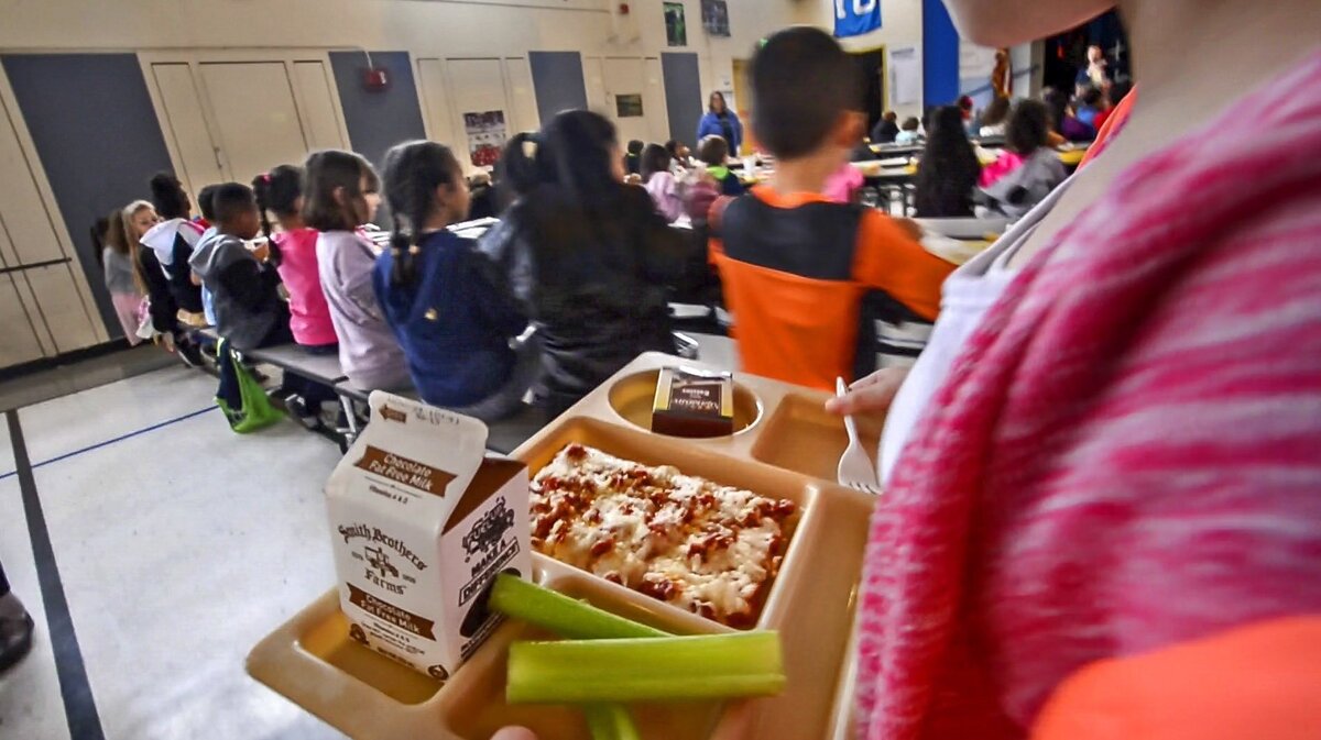 A hot lunch with fresh fruit and vegetables is served at Whitman Elementary School in Tacoma, Nov. 16, 2018. Local districts say federal money for free and reduced lunches is available for now despite the partial government shutdown.