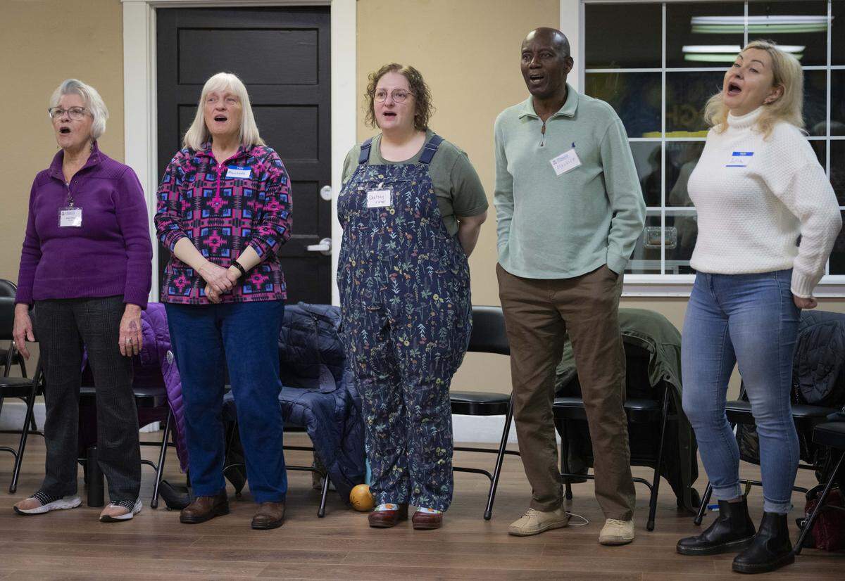 The Tacoma Refugee Choir practices for their upcoming concert, on Tuesday, Jan. 13, 2026 in Tacoma.