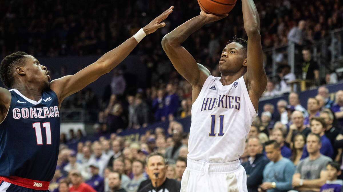 Washington Huskies guard Nahziah Carter (11) shoots a three-point-shot during the second half. The Washington Huskies played the Gonzaga Bulldogs in a NCAA basketball game at Her Edmundson Pavilion in Seattle, Wash., on Sunday, Dec. 8, 2019.