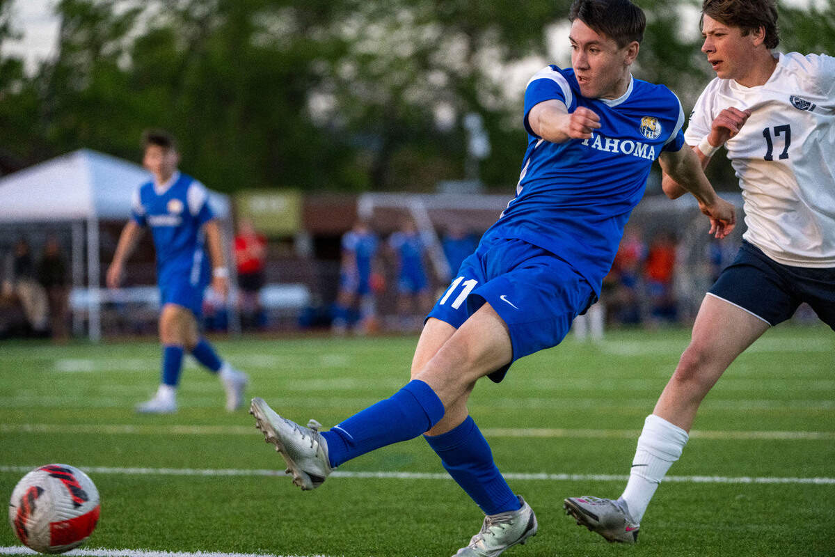 Tahoma forward Caleb Wicker attempts a shot on goal after being fouled by Bellarmine Prep’s Anthony Danylyuk in the penalty area in the first half of the 4A West Central/Southwest district soccer championship game on Thursday, May 11, 2023, at Sparks Stadium in Puyallup, Wash. A penalty kick was called on the play which Tahoma’s Ignacio Brandan scored to give the Bears a 2-0 lead.