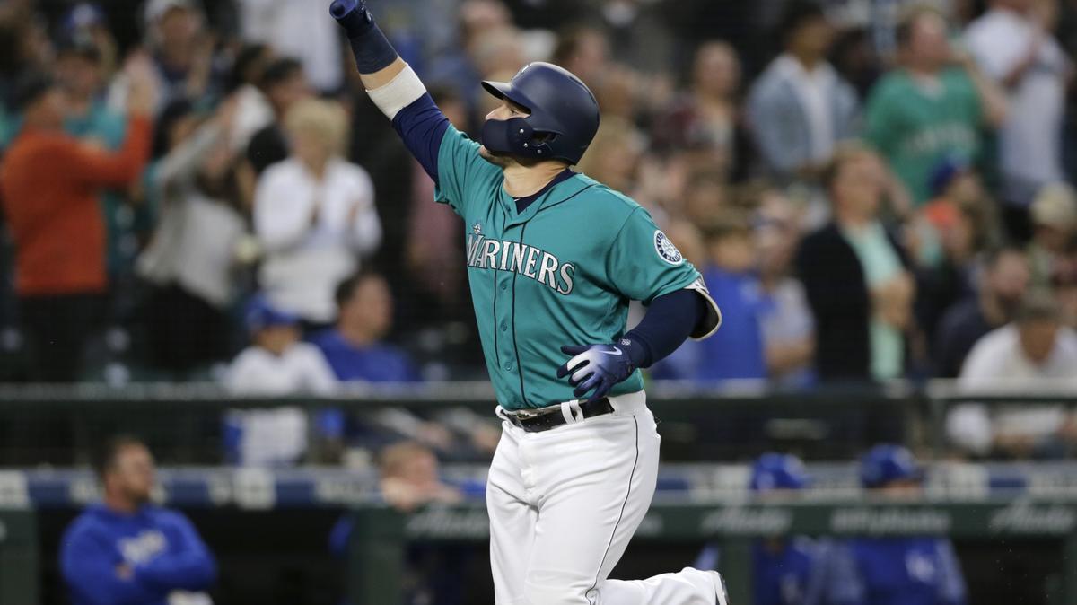 Seattle Mariners' Mike Zunino points as he runs to home plate after hitting a solo home run off Kansas City Royals starting pitcher Ian Kennedy during the fifth inning of a baseball game, Friday, June 29, 2018, in Seattle. (AP Photo/John Froschauer)