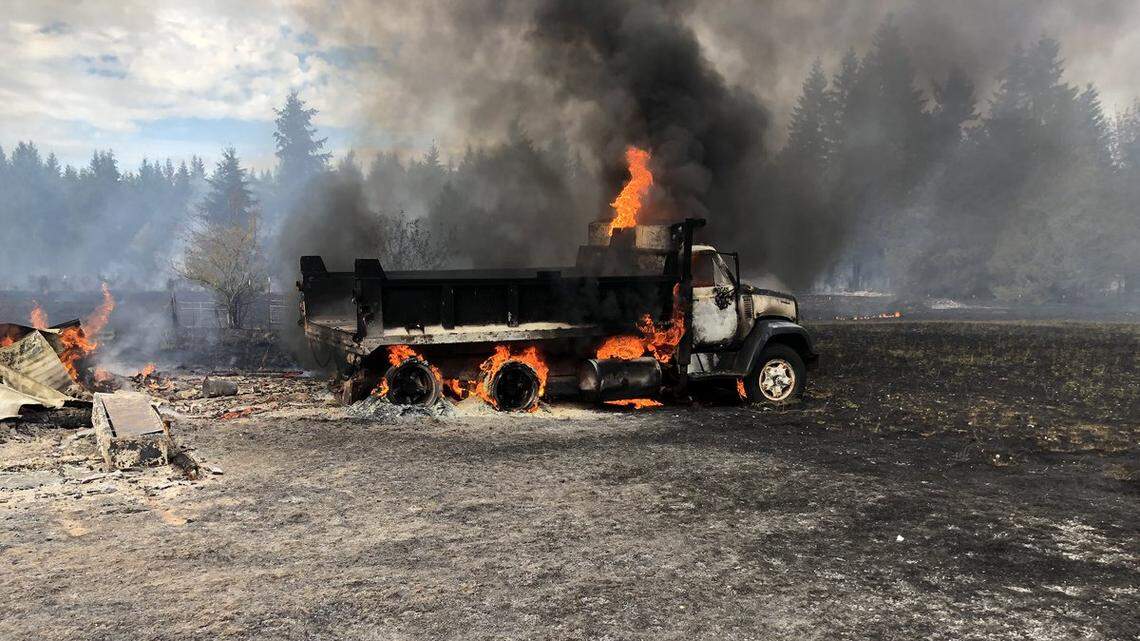 A dump truck burns during a fire Sunday afternoon in East Pierce County.