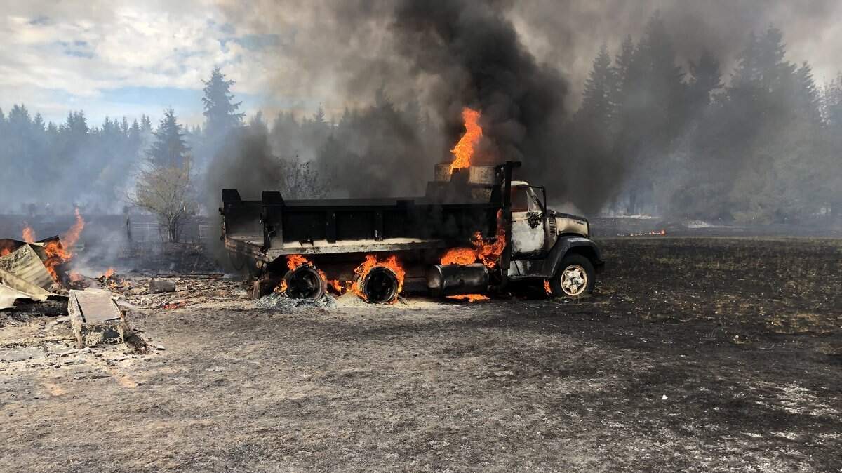 A dump truck burns during a fire Sunday afternoon in East Pierce County.
