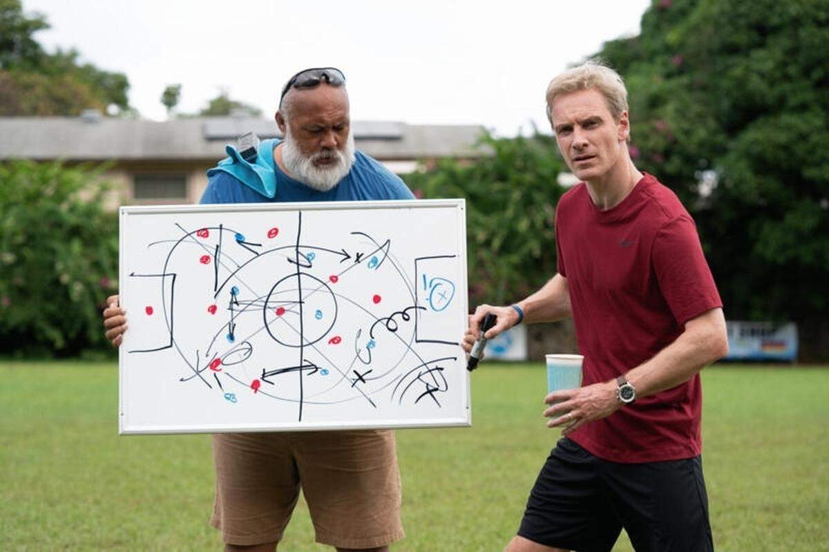 David Fane (left) and Michael Fassbender in “Next Goal Wins.”