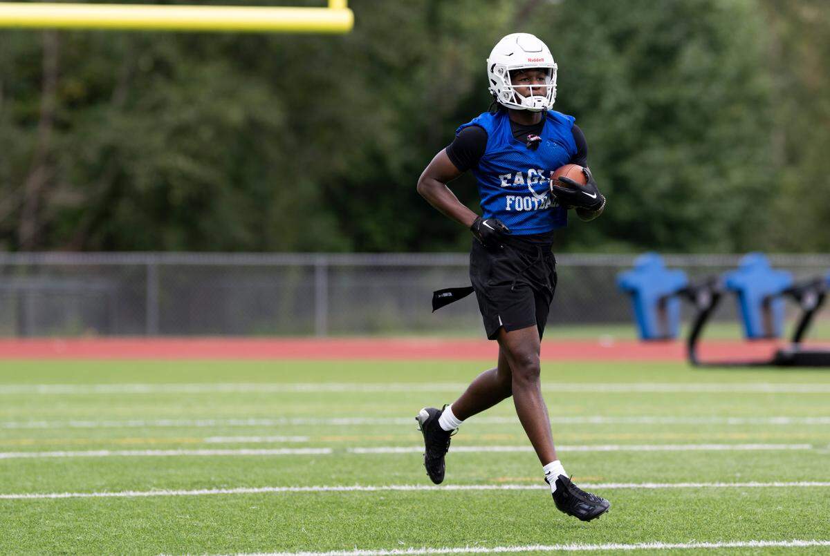 Graham-Kapowsin wide receiver Khris Norris runs back after a catch during a football practice at Graham-Kapowsin High School, on Thursday, Aug. 22, 2024, in Graham, Wash.