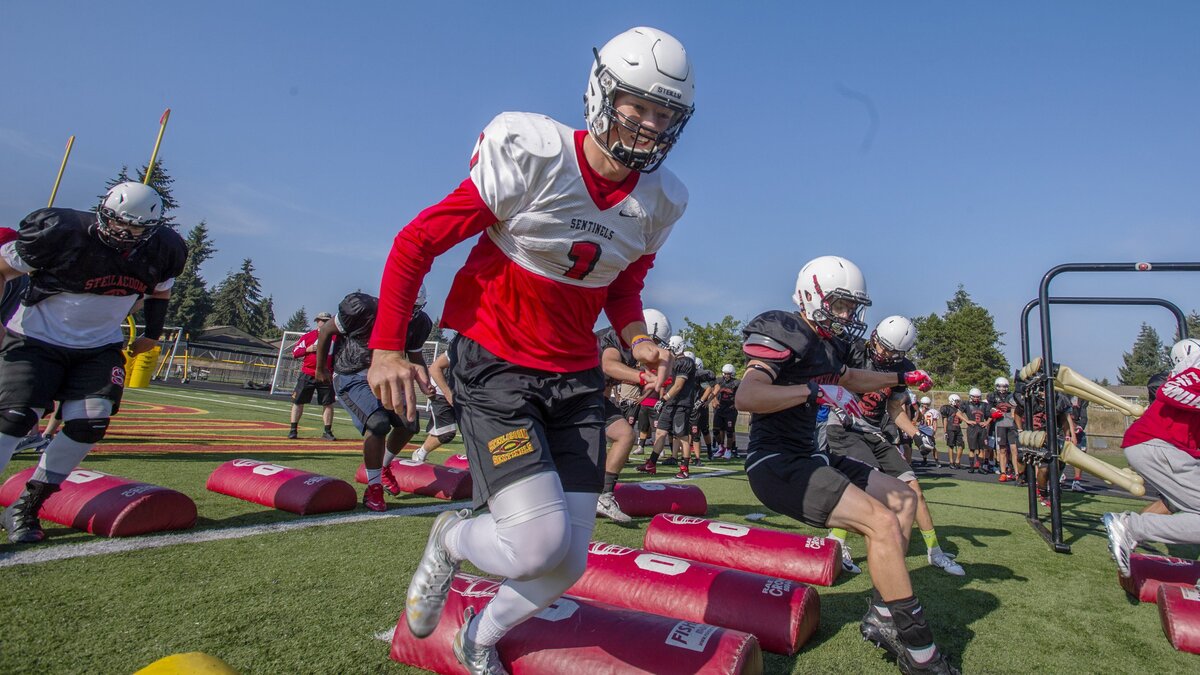 Quarterback J.J. Lemming at teammates work on an agility drill at Steilacoom High School football practice, August 18, 2018.