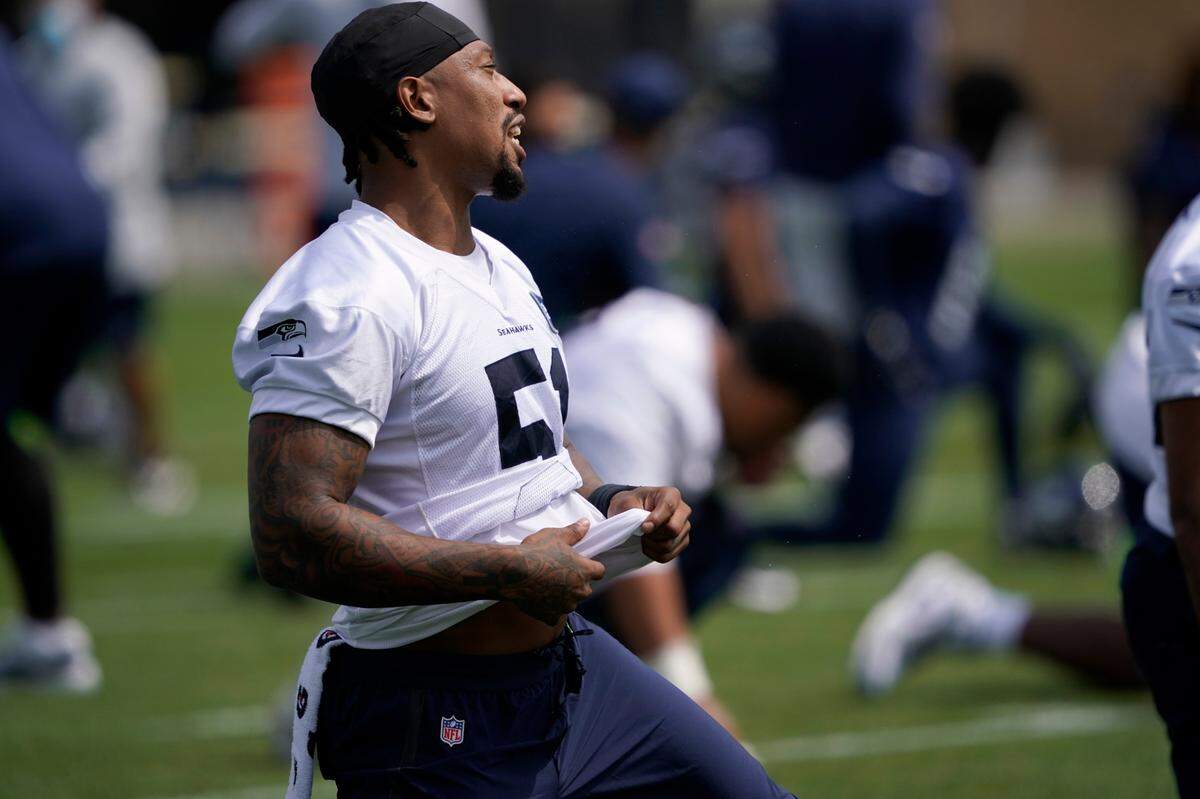 Seattle Seahawks linebacker Bruce Irvin reacts as he stretches at the start of NFL football training camp, Wednesday, Aug. 12, 2020, in Renton, Wash. (AP Photo/Ted S. Warren, Pool)