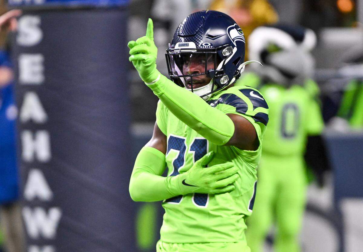 Seattle Seahawks cornerback Devon Witherspoon (21) reacts to a broken up pass against the San Francisco 49ers during the second quarter of the game at Lumen Field, Thursday, Nov. 23, 2023, in Seattle, Wash.