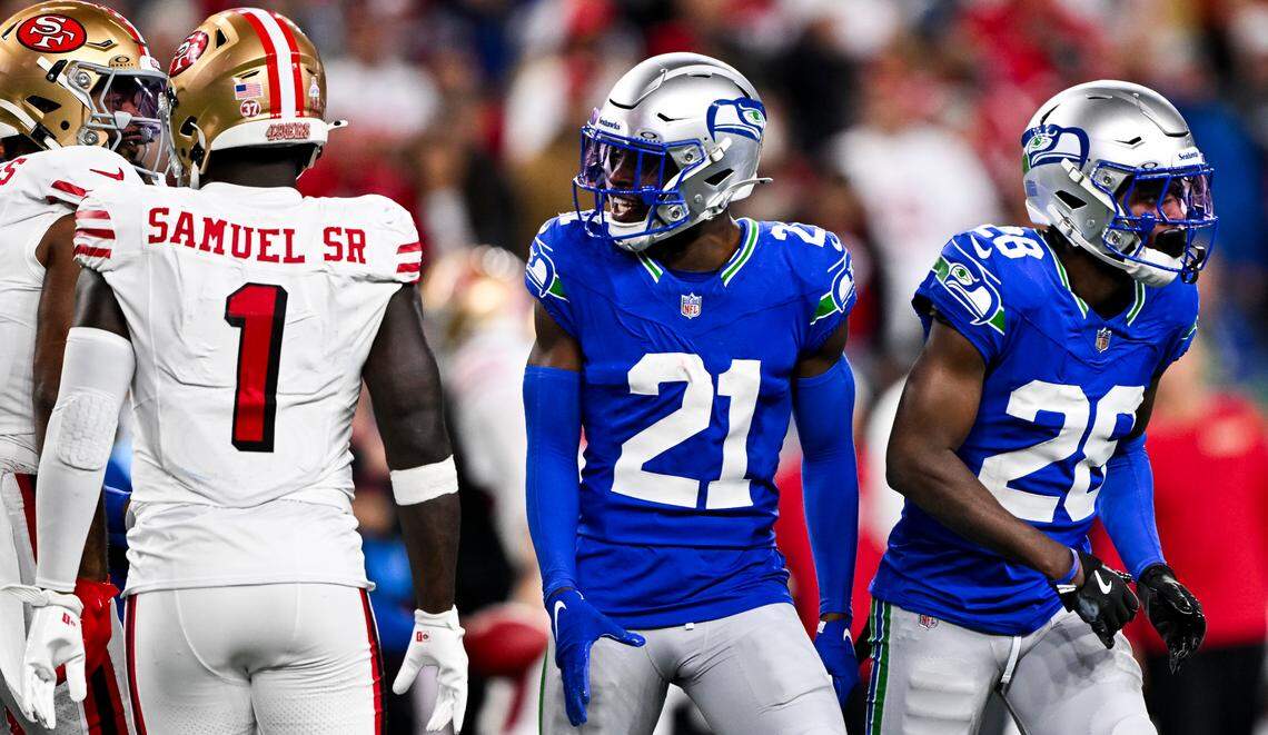 Seattle Seahawks cornerback Devon Witherspoon (21) cornerback Nehemiah Pritchett (28) react to a third-down stop against the San Francisco 49ers during the forth quarter of the game at Lumen Field, on Thursday, Oct. 10, 2024, in Seattle, Wash.