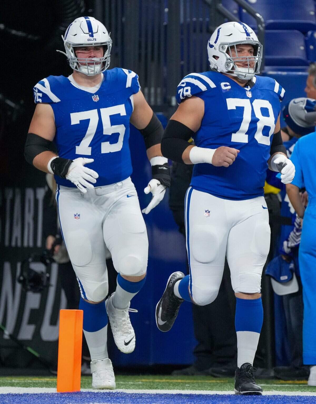 Indianapolis Colts guard Will Fries (75) and center Ryan Kelly (78) enter the field before the game against New Orleans, Sunday., Oct 29, 2023, at Lucas Oil Stadium in Indianapolis.