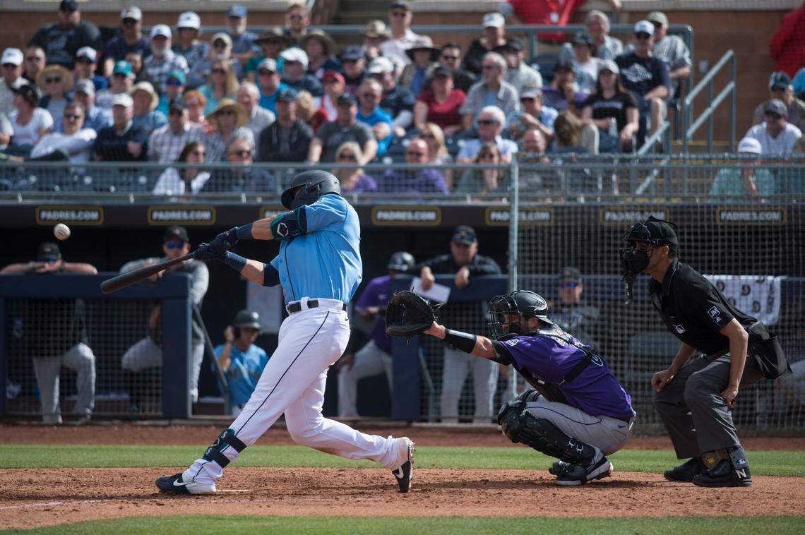 Seattle Mariners first baseman Evan White hits in a spring training game against the Rockies on Monday, March 2, 2020 at Peoria Stadium in Peoria, Ariz.