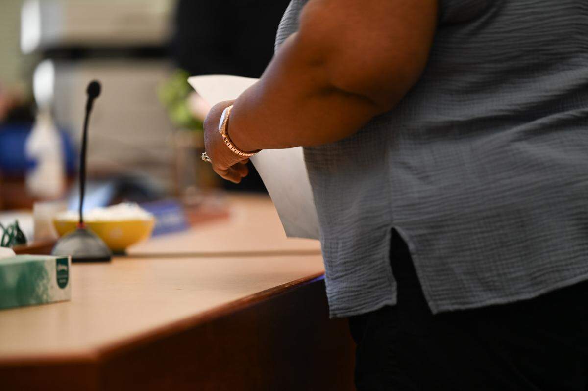 Danielle Benson, grandmother of Sarai Brooks, holds up a photo of Sarai while testifying to the court during the sentencing hearing for Augustino Maile in Pierce County Superior Court on Thursday, July 11, 2024 in Tacoma. Maile was sentenced for first-degree manslaughter in the death of 2-year-old Sarai Brooks and two counts of second-degree assault for abusing two other children.