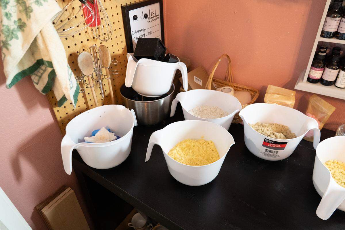 Gallagher crafts her products in a small workspace at the back of The Lazy Lily, mixing different powders and oils to create bath bombs.