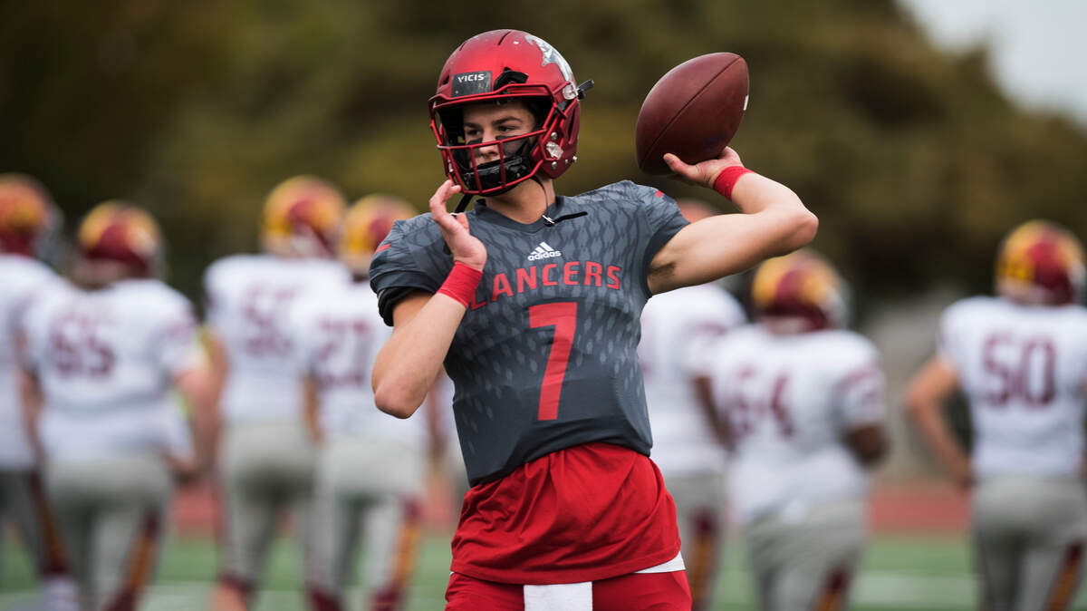 Kennedy Catholic High School quarterback Sam Huard warms up before a game. The Lancers played Enumclaw on Saturday, Sept. 29, 2018 at Highline Memorial Stadium in Burien.