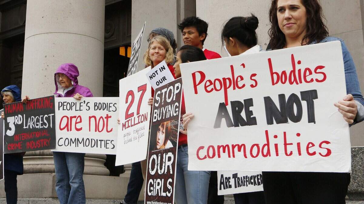 People opposed to child sex trafficking rally outside of the Washington state Supreme Court in 2014. The court was hearing a case filed by three victims who say the website Backpage.com helps promote the exploitation of children.