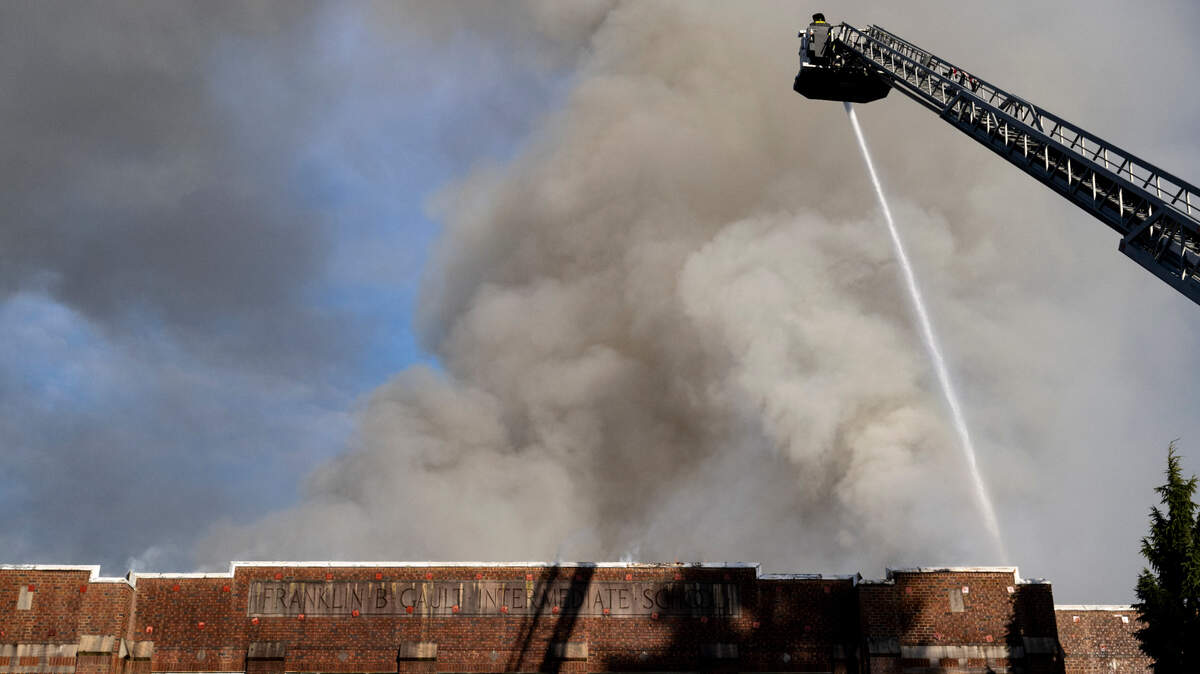Tacoma Fire Department crews battle a fire in the former Gault Middle School building, on Wednesday, Jan. 3, 2024, in Tacoma. Crews responded around 4:14 a.m. and continue to douse it after 10 a.m.