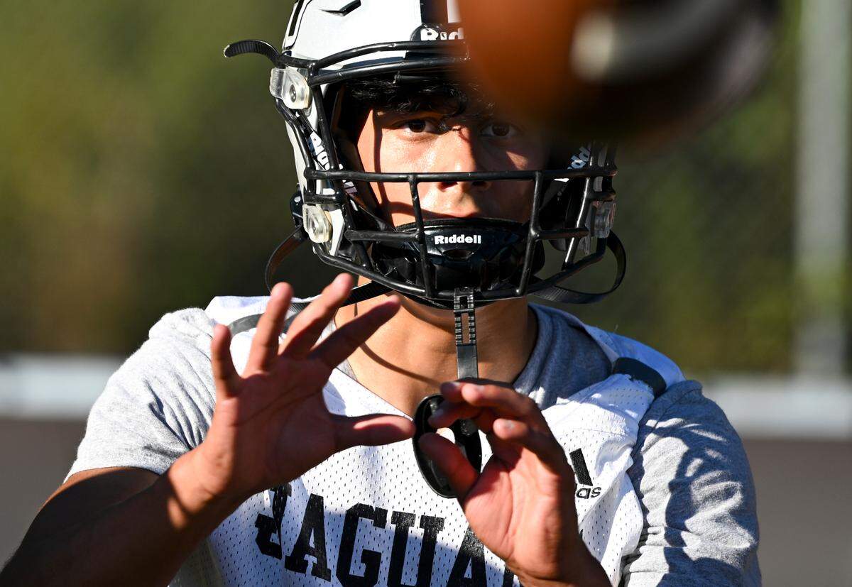 Emerald Ridge wide receiver Tony Harste does a catching drill during a football practice at Emerald Ridge High School, Wednesday, Aug. 16, 2023, in Puyallup, Wash.