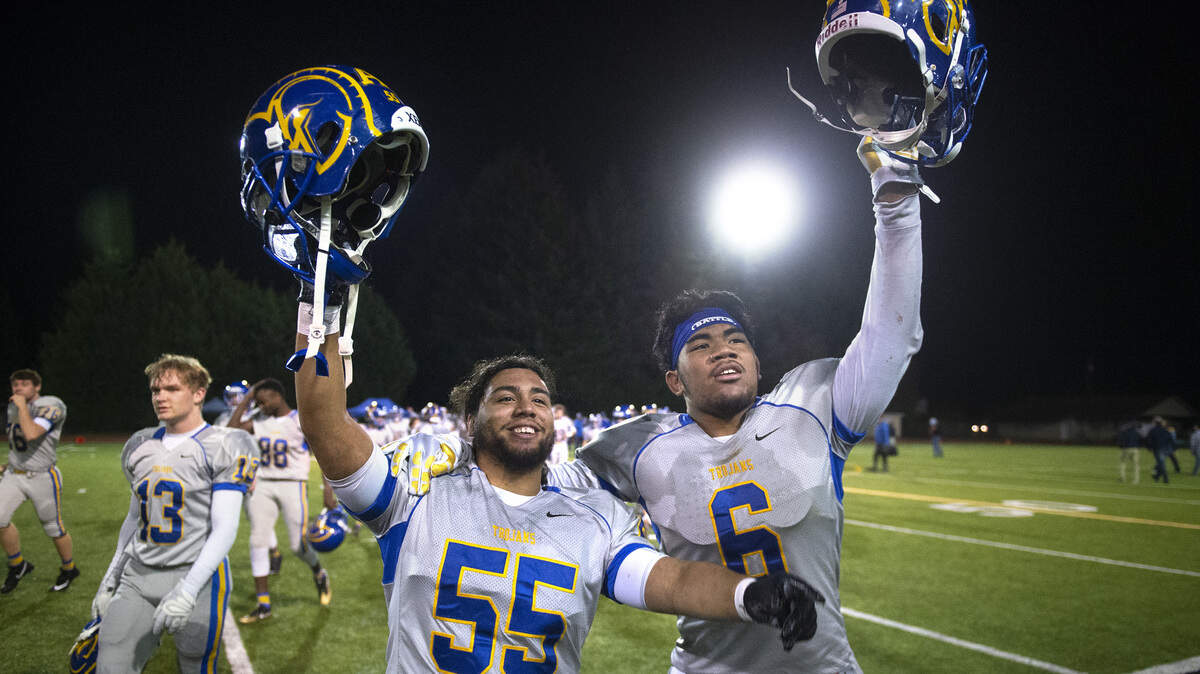 Fife senior lineman Elian Ramos (55) and sophomore liinebacker Malakai Samuelu celebrate following Friday night’s 2A football state quarterfinal victory over the Black Hills Wolves, 14-0, at Tumwater District Stadium on Nov. 16, 2018.