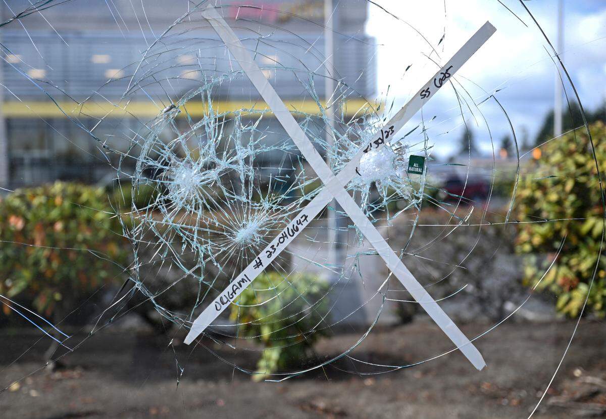 A broken pane of glass at a vandalized bus shelter on Pacific Avenue South, Wednesday, Sept. 20, 2023, in Tacoma. Pierce Transit crews work on dozens of bus shelters every day.
