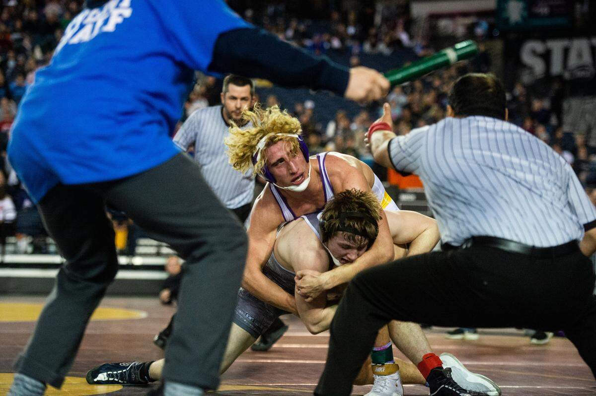 Puyallup’s Isaac Clark wrestles Chiawana’s Tyson Stover in the 4A 182 pound championship during day two of Mat Classic XXXII at the Tacoma Dome in Tacoma, Wash., on Saturday, Feb. 22, 2020.
