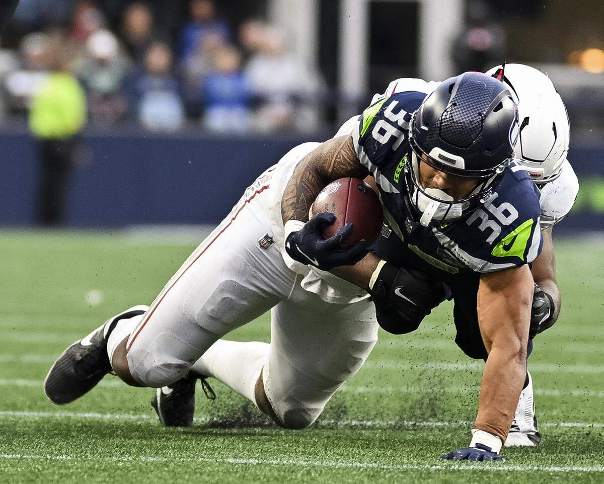 Seattle Seahawks running back George Holani (36) stretches out on the carry against the Arizona Cardinals during the fourth quarter of the game at Lumen Field, on Sunday, Nov. 9, 2025, in Seattle.