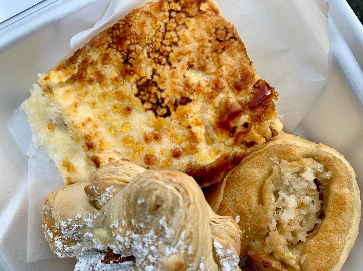 Old Times Bakery in Tacoma churns out a vast array of international pastries, with a bent toward European-influenced Central American sweets such as massini, a cream-filled sponge cake flambéd like a crème brûlée. Pictured with it: a coconut roll and a walnut cream Danish.