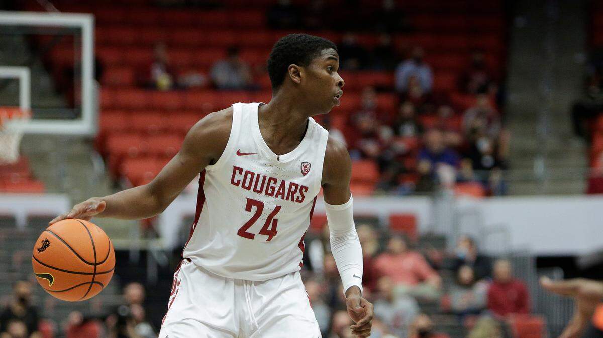 Washington State guard Noah Williams controls the ball during the first half of an NCAA college basketball game against Oregon State, Thursday, March 3, 2022, in Pullman, Washington.