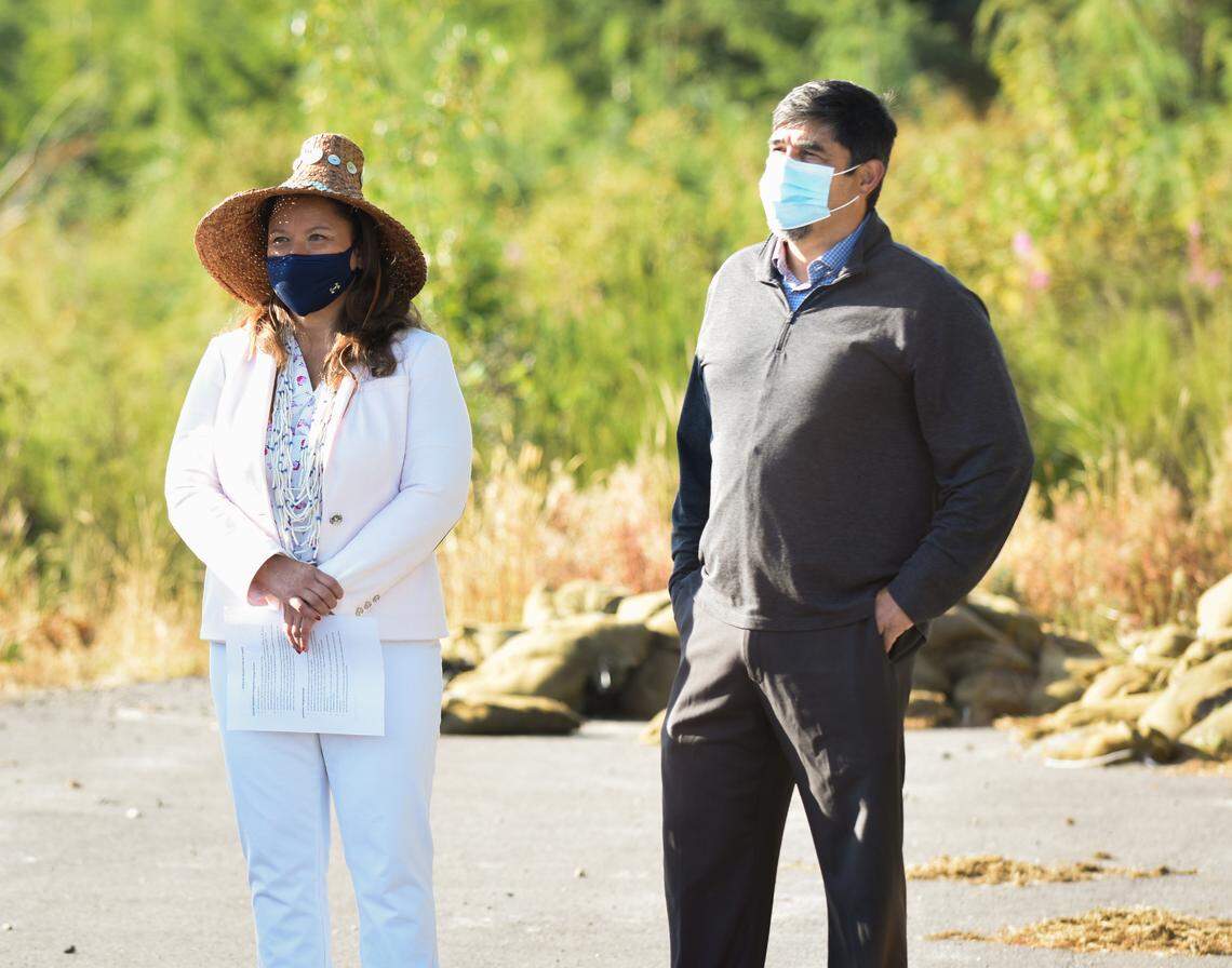 Quinault Indian Nation President Guy Capoeman, right, and National Congress of American Indians President and Quinault Indian Nation Vice President Fawn Sharp view the tribe’s new housing development being built out of a tsunami zone Monday, Aug. 9, on the Quinault Indian Reservation in Taholah, Wash.