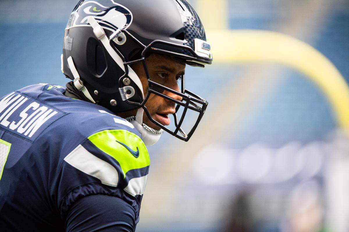 Seattle Seahawks quarterback Russell Wilson looks on before the game. The Seattle Seahawks played the Los Angeles Rams in a NFL wildcard playoff game at Lumen Field in Seattle, Wash., on Saturday, Jan. 9, 2021.