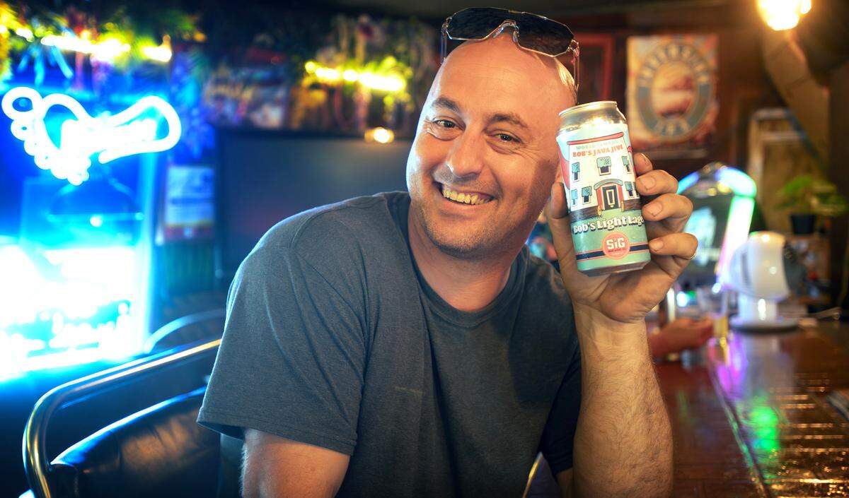 Owner Richard Walden with Java Jive’s signature “Bob’s Light Lager” at the historic Bob’s Java Jive tavern in Tacoma, Washington, shown on Monday, July 1, 2024.