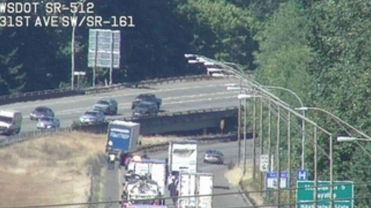 The left lane is blocked on state Route 512 eastbound after a truck driver struck a cable barrier on August 12, 2025.