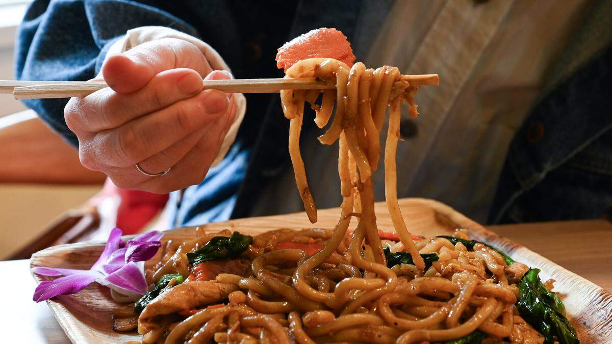 Bloom Thai Cuisine opts for udon in the pad kee mao (”drunken noodles”) and pad see ew (shown here), two of the Lakewood restaurant’s most popular dishes.