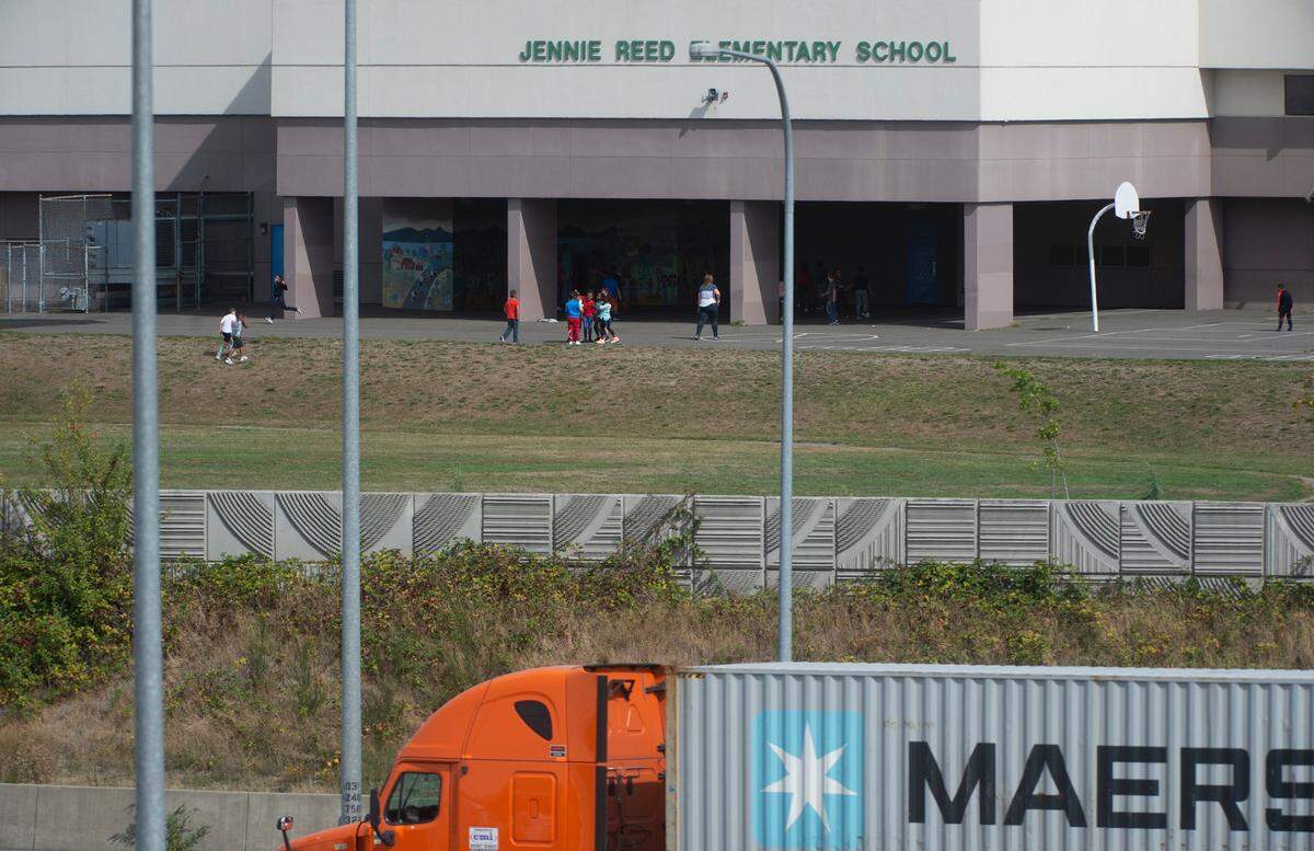 Interstate 5 freeway traffic flows past Jennie Reed Elementary School in Tacoma on Wednesday, Sept. 11, 2019. School officials are hoping WSDOT will replace the trees that used to line the freeway to help decrease noise and exhaust.