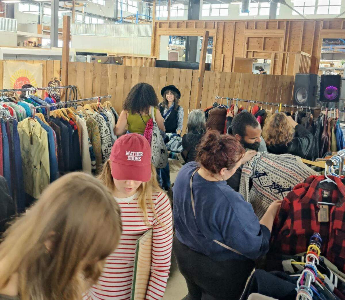 Shoppers explore the Tacoma Flea at the Waterfront Market at Ruston.