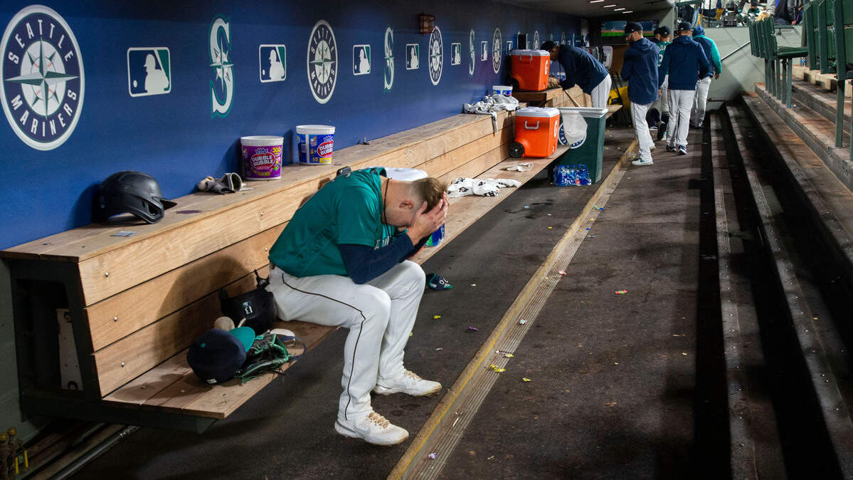 Mariners rookie Jarred Kelenic buries his heads in his hands after flying out in the bottom of the ninth inning to end the game and possibly Seattle’s playoff hopes as the Angels prevailed with a 2-1 victory Friday night, Oct. 1 at T-Mobile Park.