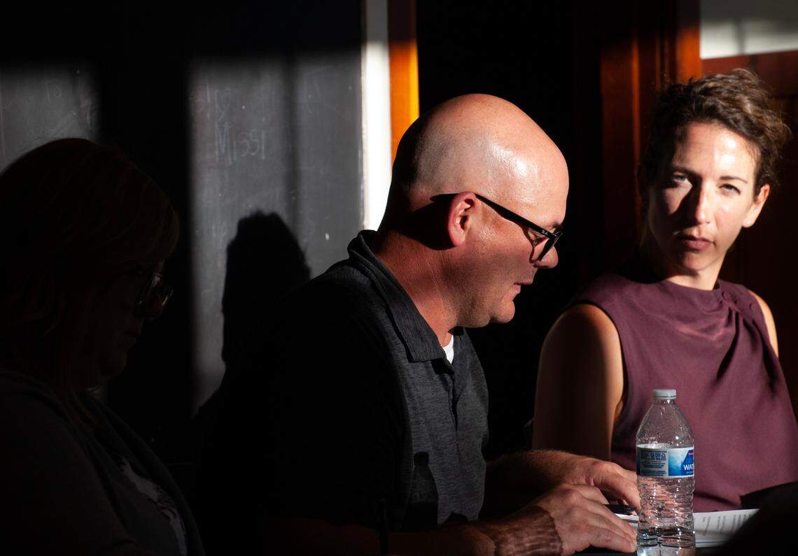 The Peninsula Metropolitan Park District Director of Park Services, Denis Ryan, and Executive Director Ally Bujacich sit during the district board meeting on July 18, 2023 at the Arletta Schoolhouse.