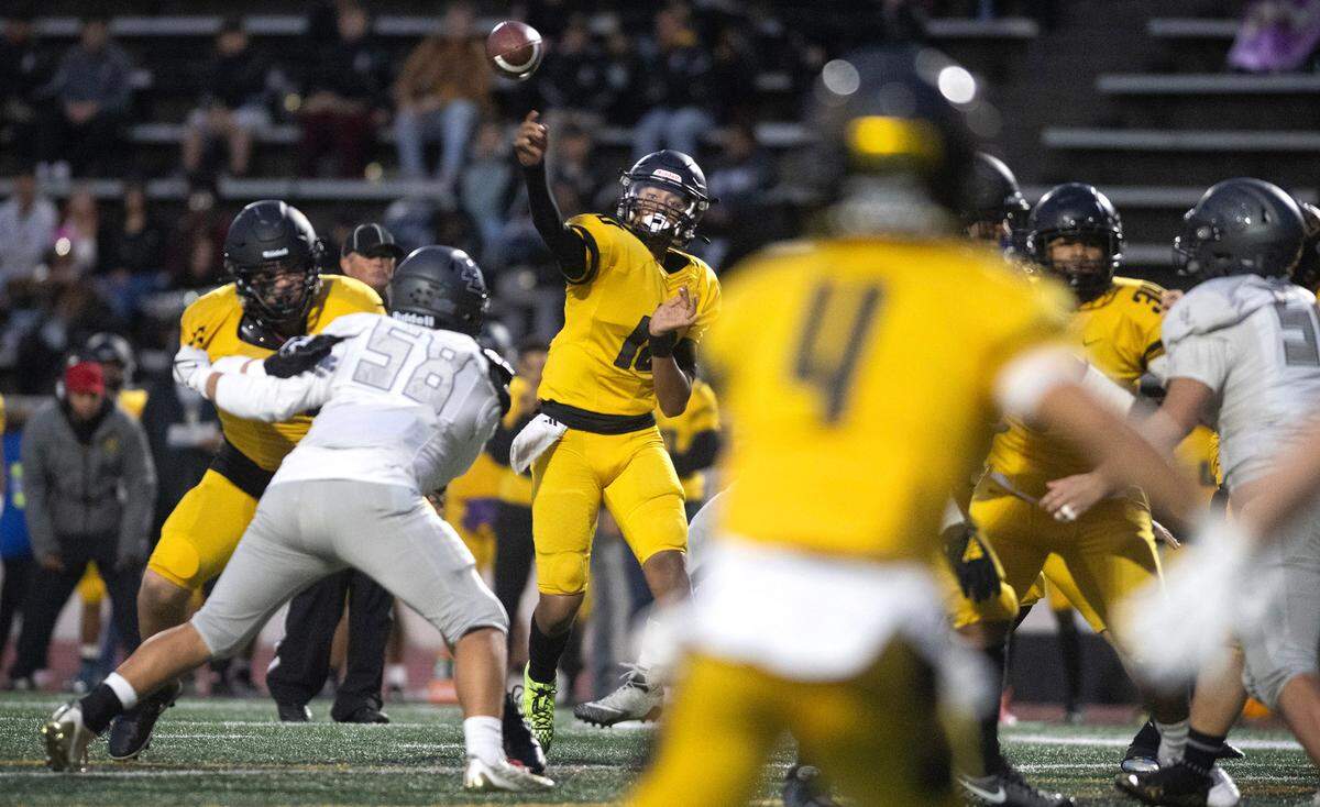 Lincoln quarterback Sione Kahn fires a pass to wide receiver Jemani Teplasy (4) during Thursday night’s football game against the Bonney Lake Panthers at Lincoln Bowl in Tacoma, Washington, on Sept. 28, 2023. Lincoln won the game, 42-28.